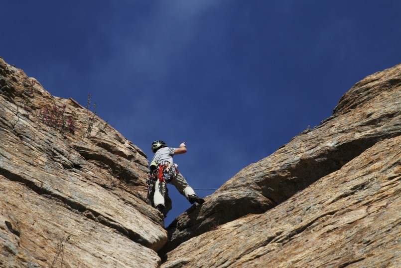 person rock climbing  
