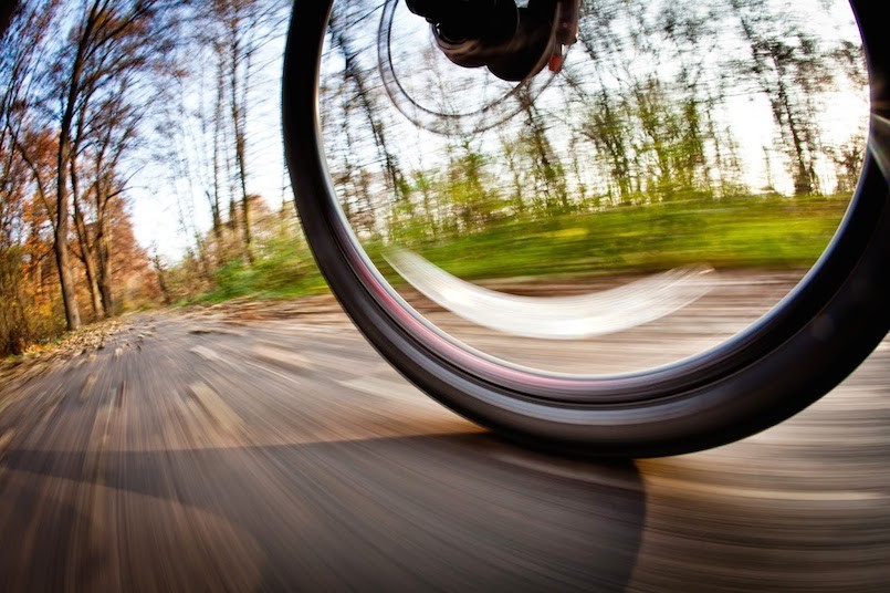 spinning bicycle wheel outdoors on trail