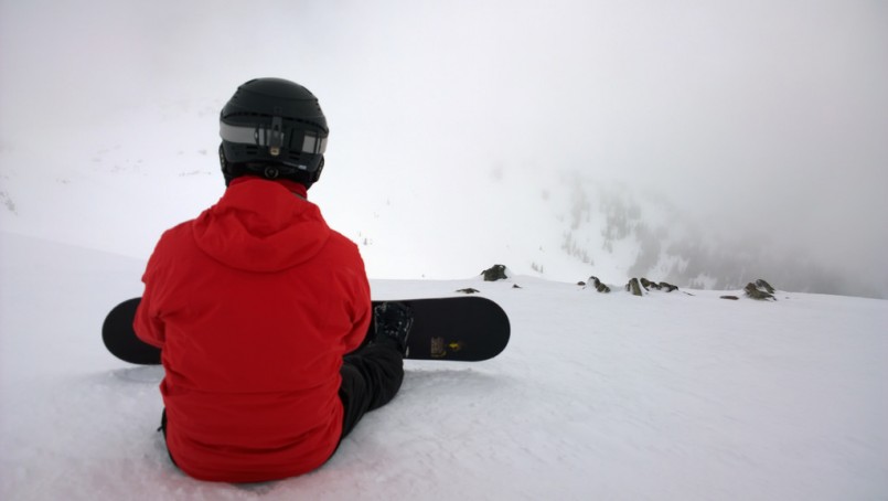 snowboarder waiting for the clouds to clear