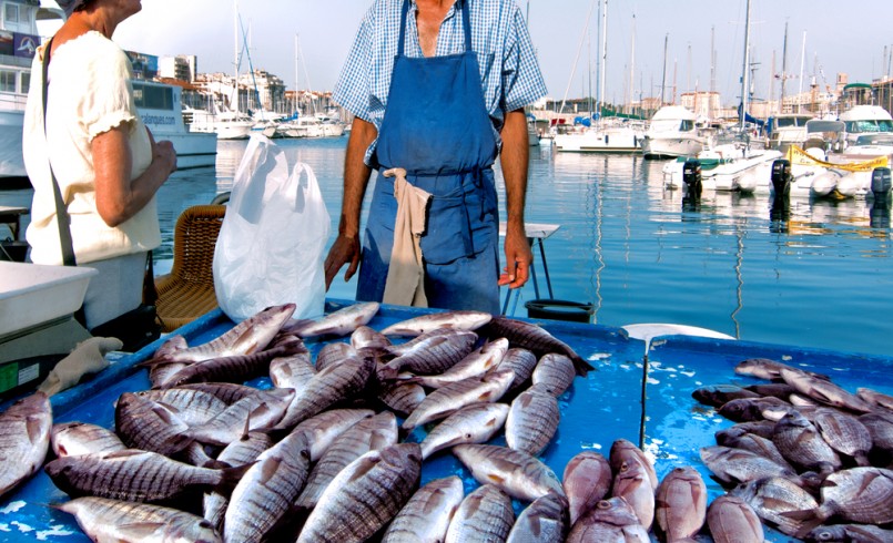 France. Marseille. Fish Market. Yachts. The seller and buyer