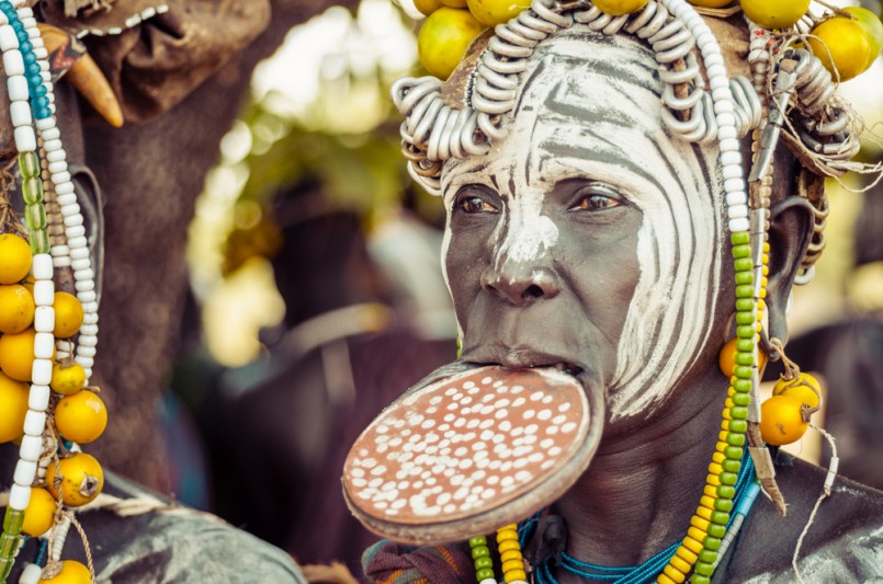 unidentified woman from Mursi tribe with big lip Plate. In the Mursi tribe, the more the lip plate is big, the more the woman is considered beautiful