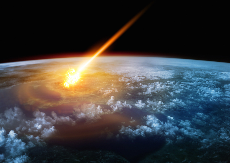 a meteor glowing as it enters the earths atmosphere
